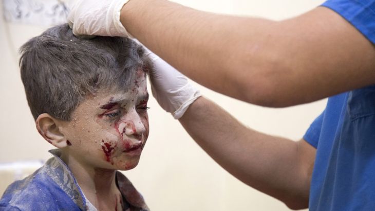 A Syrian boy receives treatment at a make-shift hospital following air strikes on rebel-held eastern areas of Aleppo