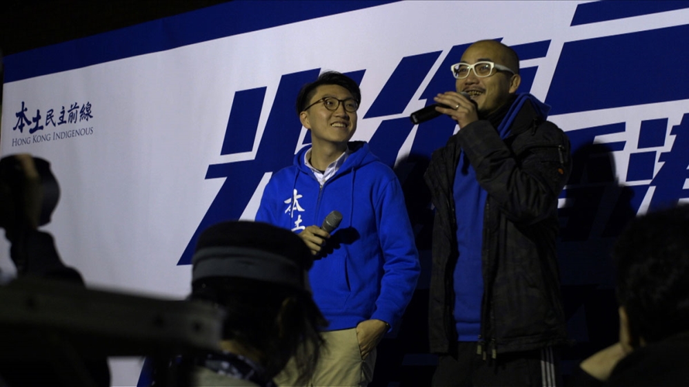 Edward Leung Tin-kei, left, 25, is a spokesperson of Hong Kong Indigenous and one of six pro-independence candidates banned from running in the upcoming election [Al Jazeera]