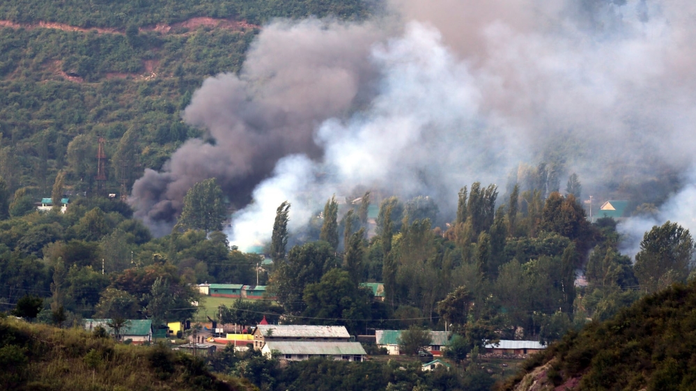 Smoke billows out from inside an Indian Army base which was attacked by suspected rebels in Uri [EPA]