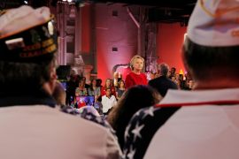 U.S. Democratic presidential candidate Hillary Clinton listens to a question at a presidential candidates "Commander-in-Chief" forum aboard the decommissioned aircraft carrier "Intrepid" in New York