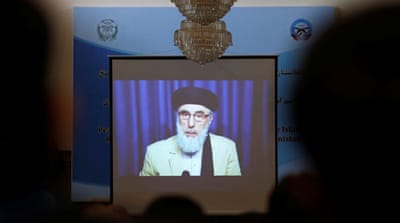 A screen shows the broadcast of Gulbuddin Hekmatyar during the signing ceremony with the Afghan government at the presidential palace in Kabul late September, 2016 [Omar Sobhani/Reuters]