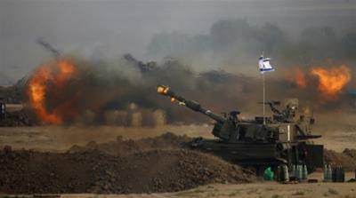 An Israeli mobile artillery unit fires towards the Gaza Strip in 2014 [Reuters]