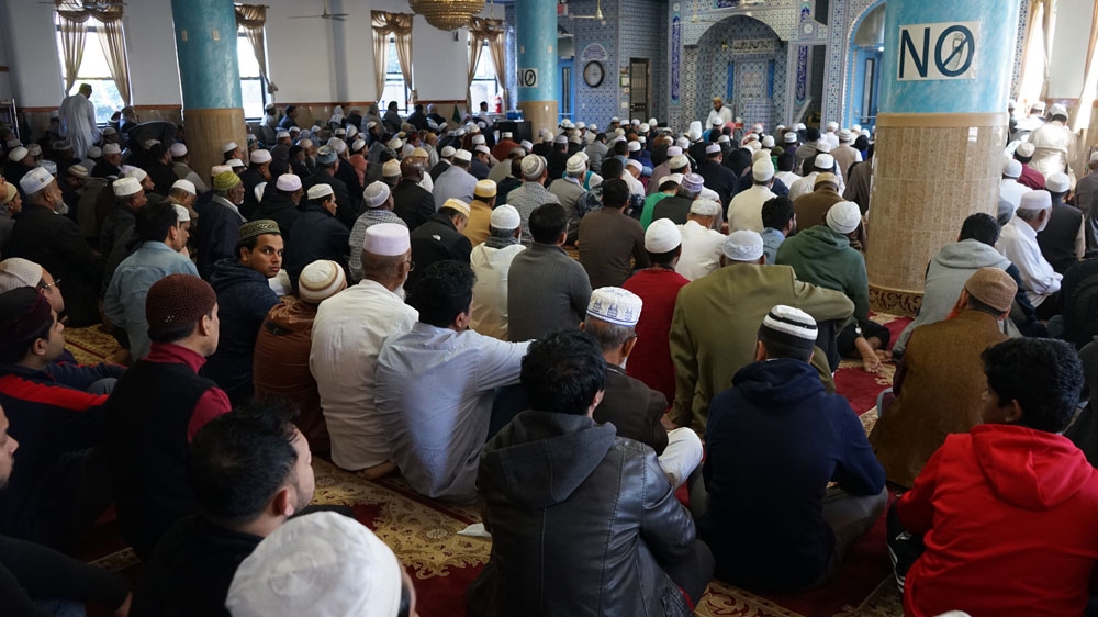Worshippers at Masjid-al-Aman mosque in Ozone Park, Brooklyn, NYC [James Reinl/Al Jazeera]