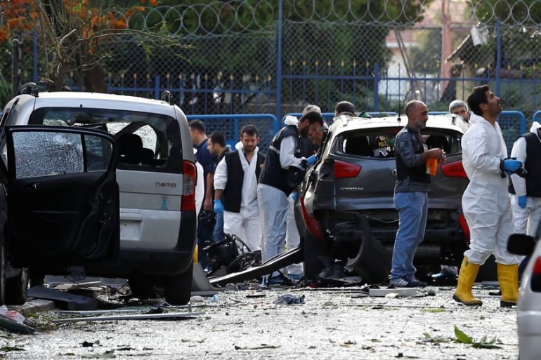 Police forensic experts examine the scene of blast in Istanbul