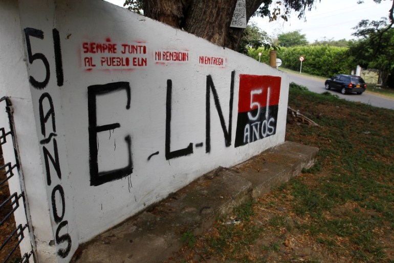 A graffiti, of rebel group Army Liberation National (ELN) is seen at the entrance of the cemetery of El Palo, Cauca, Colombia