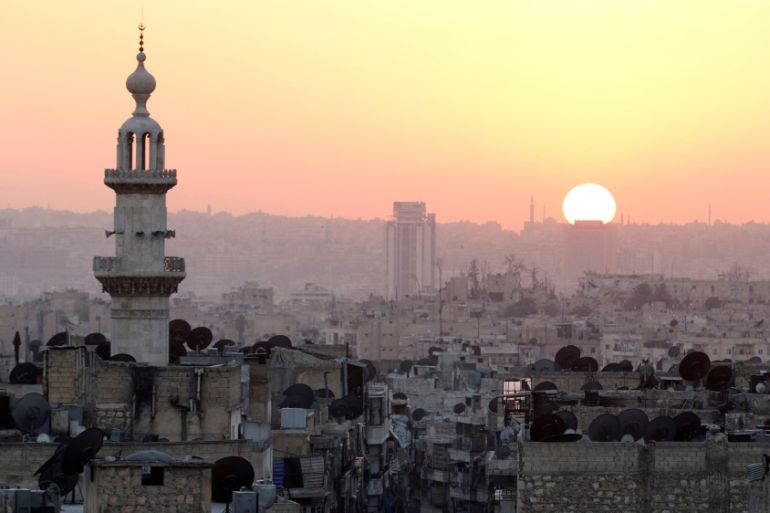The sun sets over Aleppo as seen from rebel-held part of the city, Syria [REUTERS]
