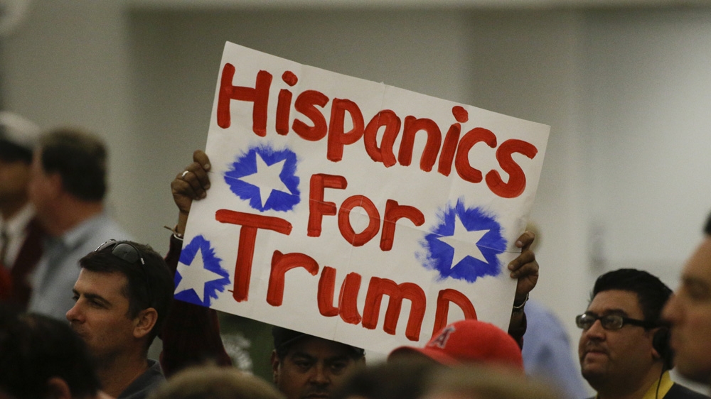 Despite being at the receiving end of his anti-immigration rhetoric, many Hispanic Americans support Republican presidential candidate Donald Trump [Jae C Hong/The Associated Press]