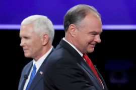 Democratic U.S. vice presidential nominee Senator Tim Kaine and Republican U.S. vice presidential nominee Governor Mike Pence pass each other after the conclusion of their vice presidential debate at