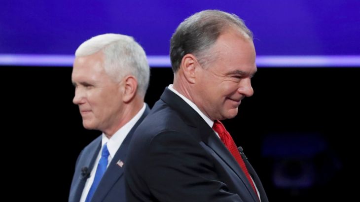 Democratic U.S. vice presidential nominee Senator Tim Kaine and Republican U.S. vice presidential nominee Governor Mike Pence pass each other after the conclusion of their vice presidential debate at