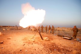 Peshmerga forces fires a mortar towards Islamic state militants'' positions in the town of Naweran near Mosul [REUTERS]
