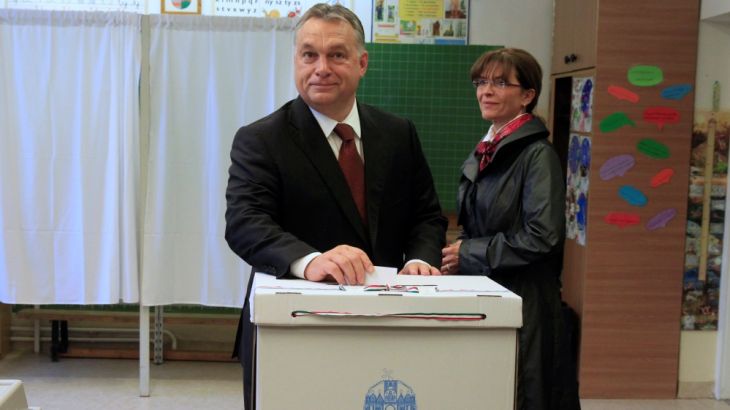 Hungary''s Prime Minister Orban casts his ballot next to his wife Levai inside a polling station during a referendum on EU migrant quotas in Budapest