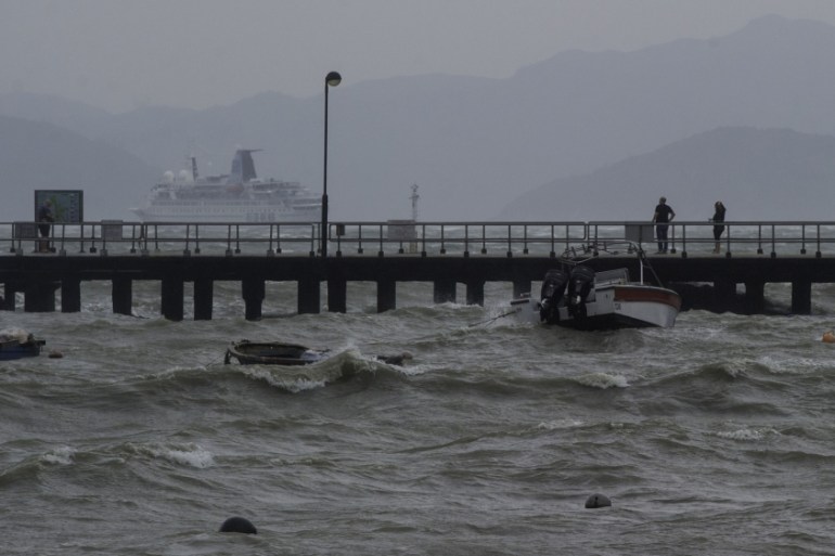 The waters around Hong Kong roughen as Typhoon Haima roars over 100km to the east