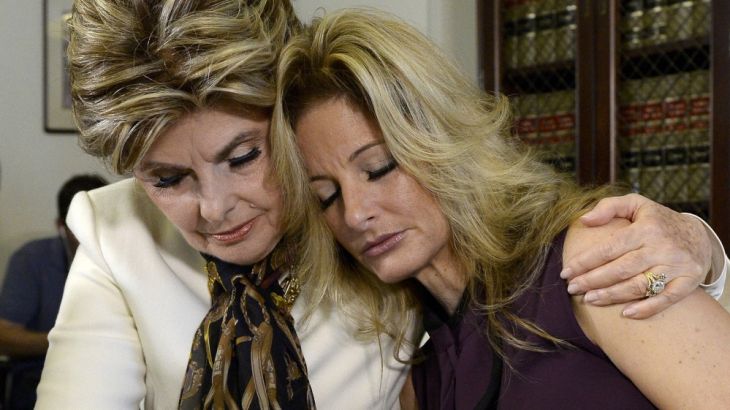Summer Zervos is embraced while speaking to reporters about allegations of sexual misconduct against Donald Trump during a news conference in Los Angeles