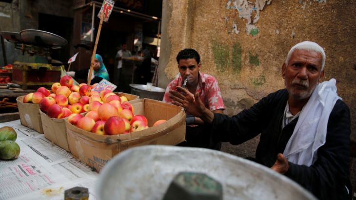 Vendors wait for customers at a market in Cairo, Egypt