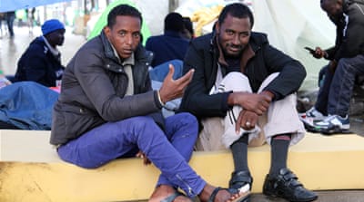Ahmed Mourtada, left, with his uncle, Ahmed Ali, both from Sudan. Mourtada plans to go to Calais once his toe heals so he can join his brother in Manchester in the UK [Lorraine Mallinder/Al Jazeera]
