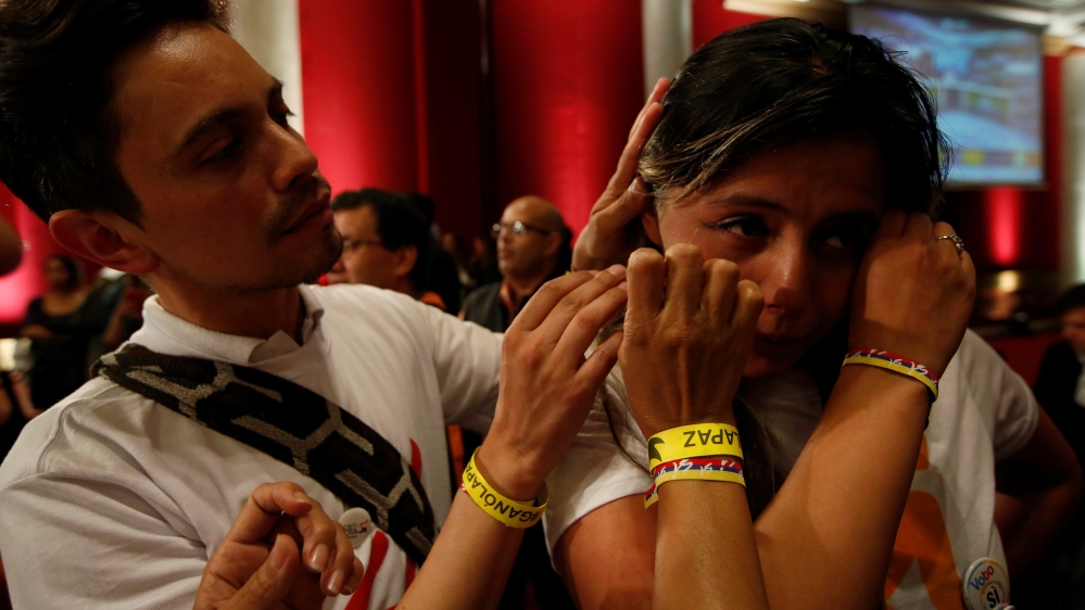 A 'yes' supporter cries after hearing the referendum results [John Vizcaino/Reuters]