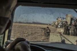 Peshmerga forces shoot during an operation to liberate several villages currently under the control of ISIL southeast of Mosul, Iraq [EPA]