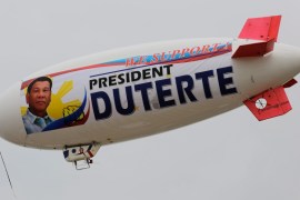 An unmanned aerial vehicle blimp with a banner supporting Philippine President Rodrigo Duterte flying along Manila Bay in Manila, Philippine [EPA]