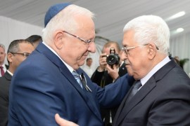 Israeli President Reuven Rivlin meeting with Palestinian President Mahmoud Abbas during the burial ceremony at the funeral of Shimon Peres [EPA]