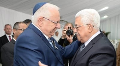 Israeli President Reuven Rivlin meeting with Palestinian President Mahmoud Abbas during the burial ceremony at the funeral of Shimon Peres [EPA]