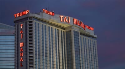The Trump Taj Mahal Casino is illuminated at dusk in Atlantic City, New Jersey, 2014 [Reuters]