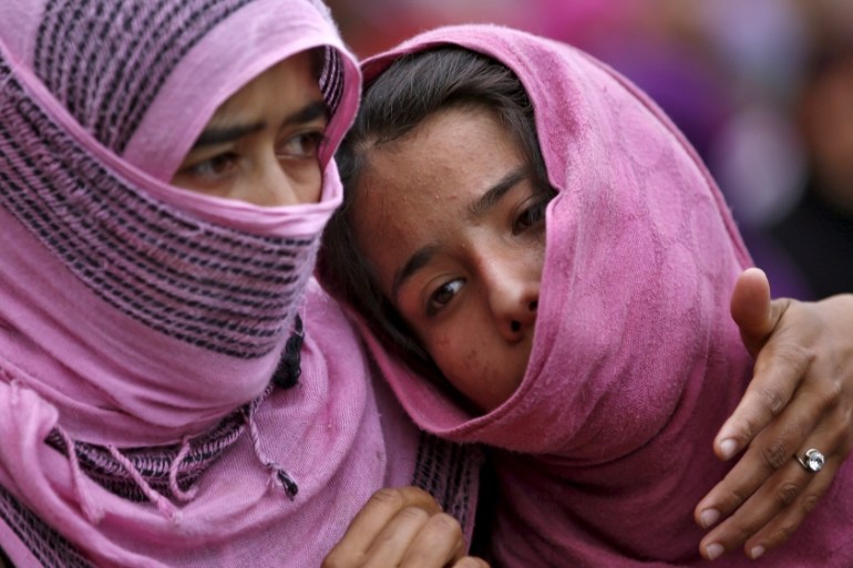 Kashmiri Muslim girls attend the funeral of Bilal Ahamd, a suspected militant, in Karimabad village in south Kashmir