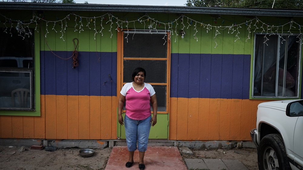 Eva Carranza is an undocumented migrant. For years, she has been unable to meet her sisters who live 30km away from her neighbourhood [Patrick Strickland/Al Jazeera] 