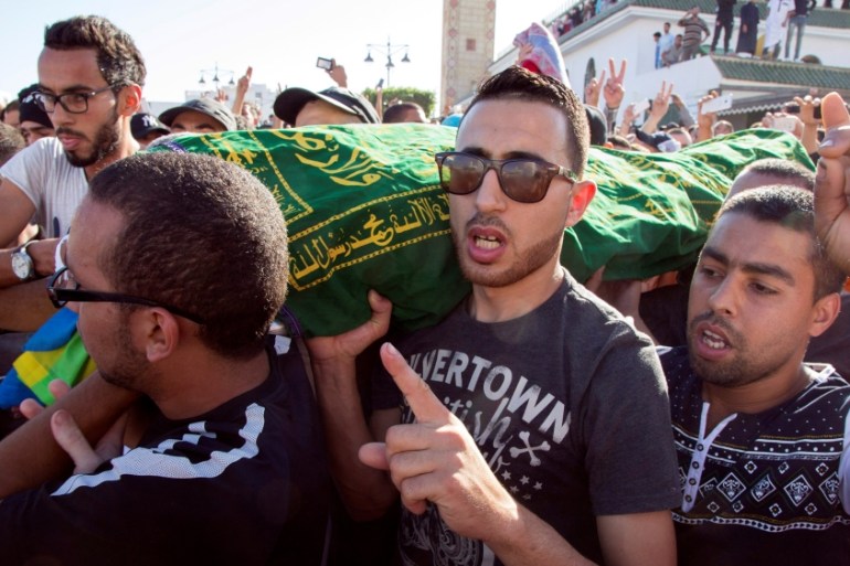 Mourners carry the coffin of fishmonger Mouhcine Fikri who was crushed to death inside a rubbish truck as he tried to retrieve fish confiscated by police in the northern town of Al-Hoceima