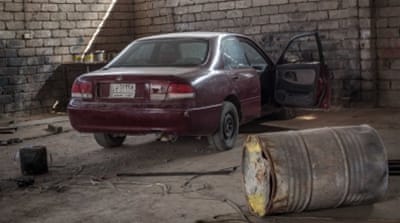 The interior of an ISIL IED factory, including an intended car bomb [John Beck/Al Jazeera] [Al Jazeera]