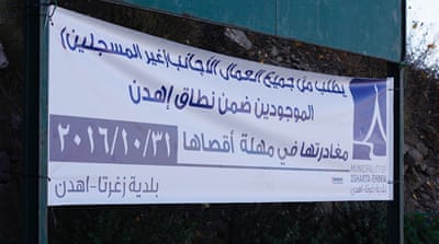 Signs have been posted asking all unregistered foreign workers to leave Ehden [Olivia Alabaster/Al Jazeera]