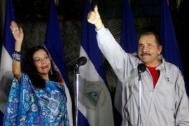 Daniel Ortega shows his ink stained thumb to the media beside his wife Rosario Murillo after they casting their vote at a polling station during Nicaragua''s presidential election in Managua