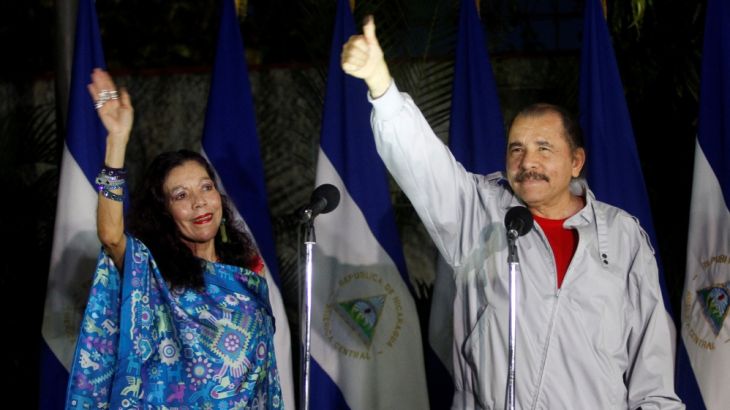 Daniel Ortega shows his ink stained thumb to the media beside his wife Rosario Murillo after they casting their vote at a polling station during Nicaragua''s presidential election in Managua