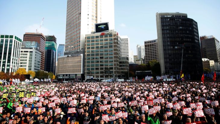 People chant slogans during a rally calling for President Park Geun-hye to step down in central Seoul
