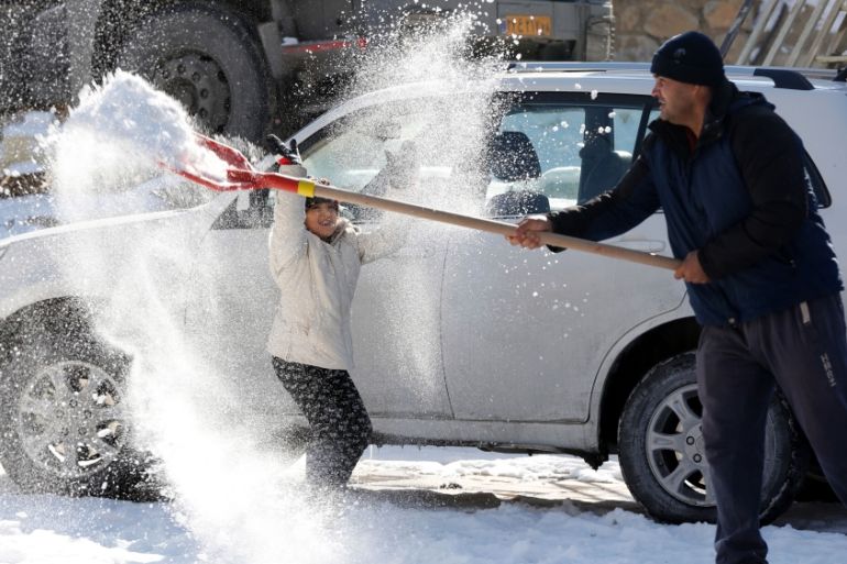 Work for him, fun for her. clearing snow in Rude Hen, Northern Iran