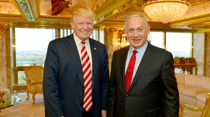 Israeli Prime Minister Benjamin Netanyahu (R) stands next to Republican U.S. presidential candidate Donald Trump during their meeting in New York