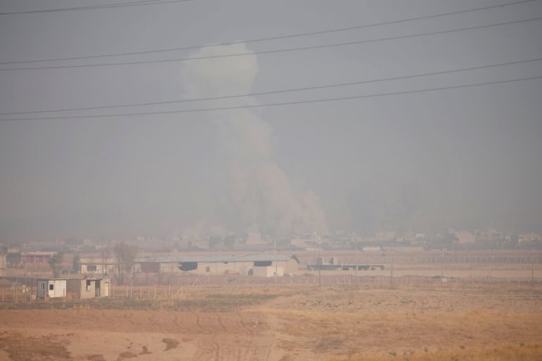 Smoke rises from clashes in the town of Bashiqa