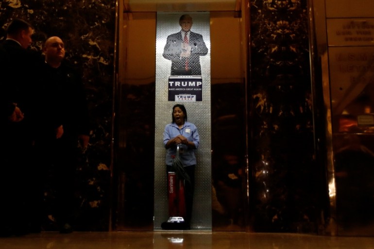A worker yawns as the elevator doors close in the lobby of Republican president-elect Donald Trump''s Trump Tower in New York