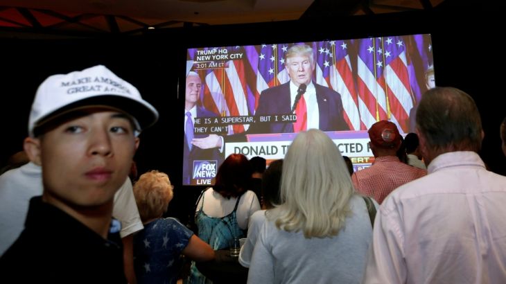 Donald Trump supporters in Phoenix, Arizona, watch the U.S. president-elect give his acceptance speech
