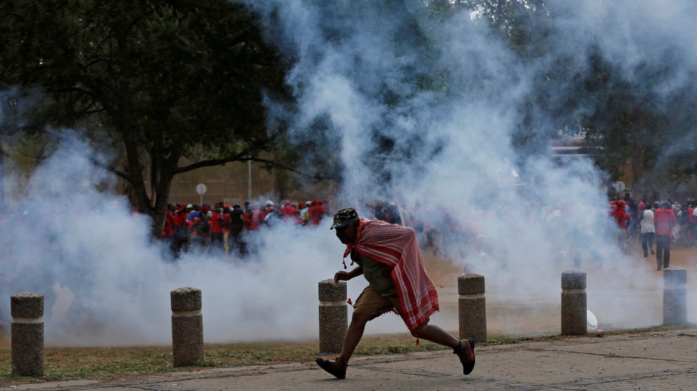 Police fired rubber bullets and used water cannon to disperse protesters who tried to storm Zuma's office [Siphiwe Sibeko/Reuters]