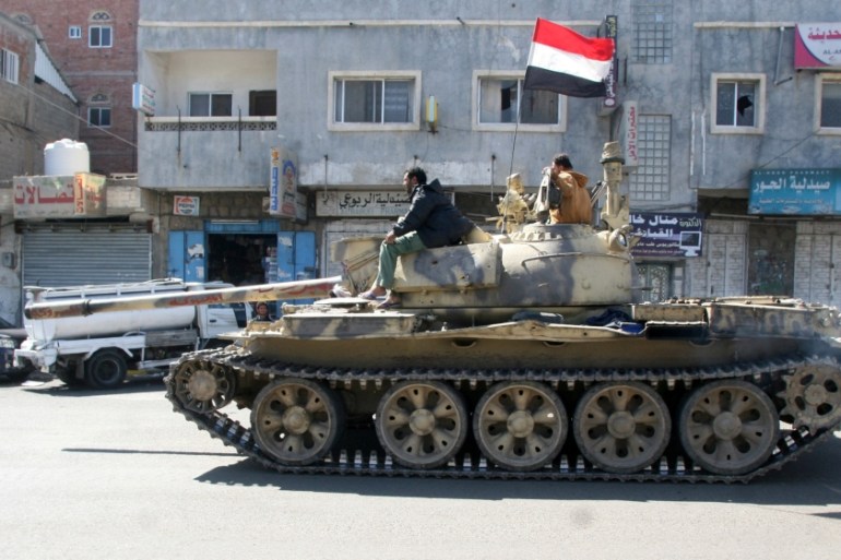 Tank used by pro-government tribal fighters is seen on a street in the southwestern city of Taiz