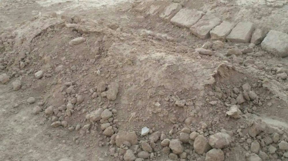  'ISIL had planted road bombs, and landmines, which pose a serious threat to any attempt at working on the site of the second mass grave for now' [Salam Khoder/Al Jazeera]