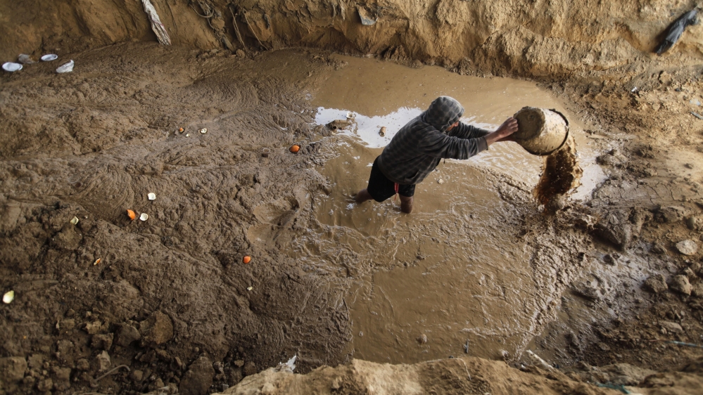  Egypt also flooded the Gaza tunnels in 2013 with sewage water, after orders from former president Mohamed Morsi. Here, a Palestinian woman is pictured clearing out one of the tunnels [AP] 