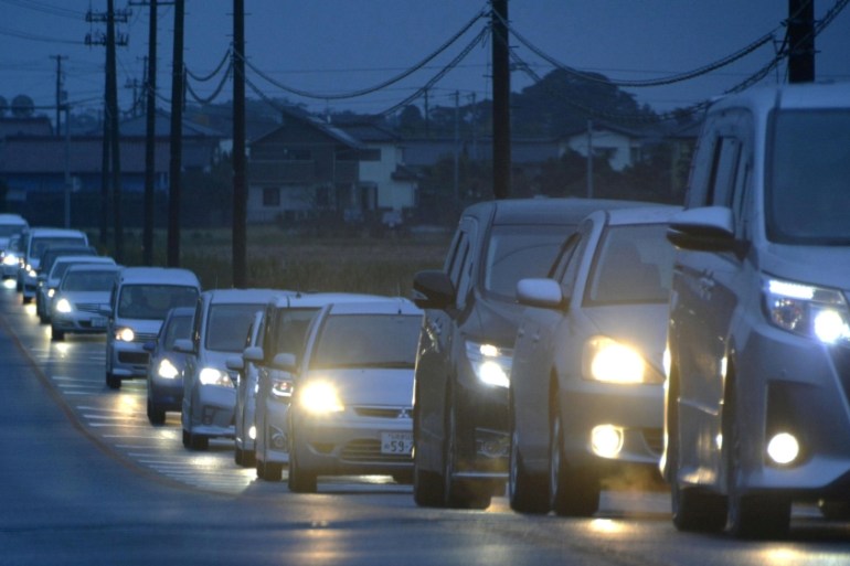 A traffic jam is seen as people evacuate after tsunami advisories were issued following an earthquake, in Iwaki