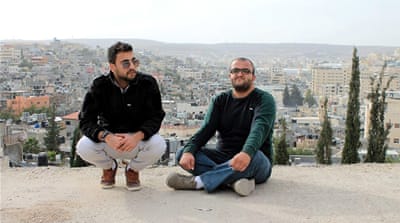 Soud Hefawi and Mohammed Azmi use hip-hop music to express their frustrations with living under occupation [Jaclynn Ashly/Al Jazeera]