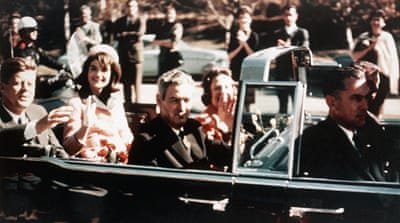 JFK rides through the streets of Dallas, Texas on November 22, 1963 [Corbis via Getty Images]