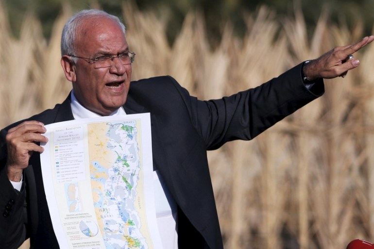 Palestinian Chief negotiator Saeb Erekat holds a map as he speaks to media about the Israeli plan to appropriate land, in Jordan Valley near the West Bank city of Jericho