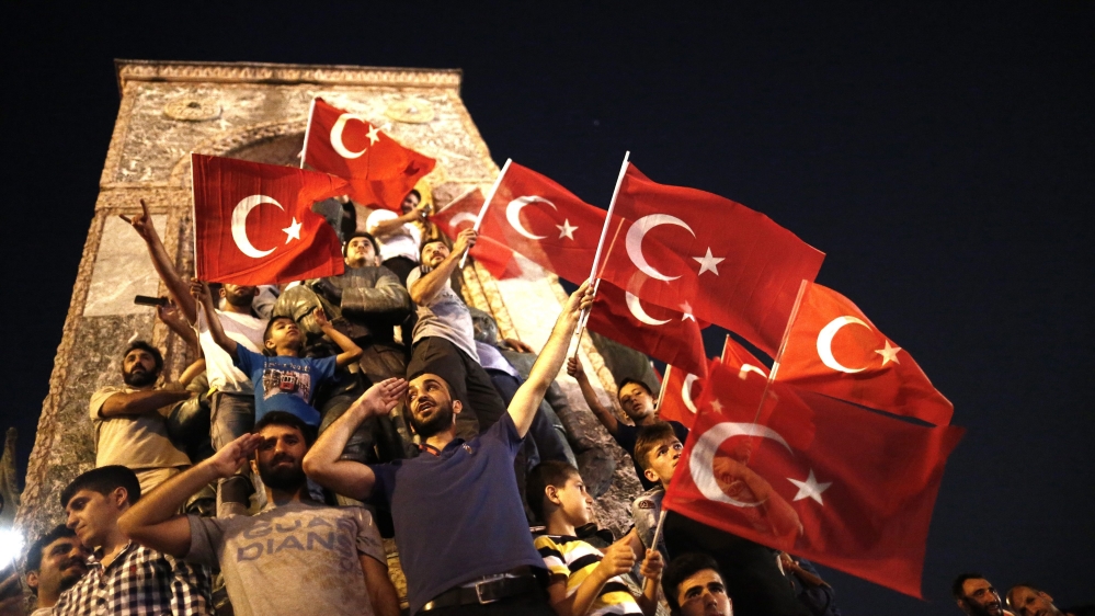 Supporters of Turkish President Recep Tayyip Erdogan shout slogans and hold flags after a failed coup attempt [EPA]