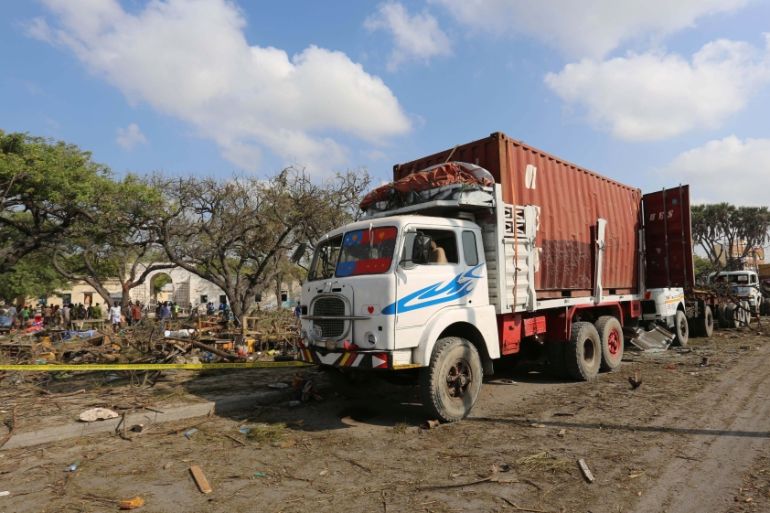 Trailers are seen parked outside a police cordon after a suicide car bomb went off at the entrance of Somalia''s biggest port in its capital Mogadishu