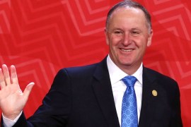 File photo of New Zealand''s Prime Minister John Key waveing to photographers during the APEC Summit in Lima, Peru