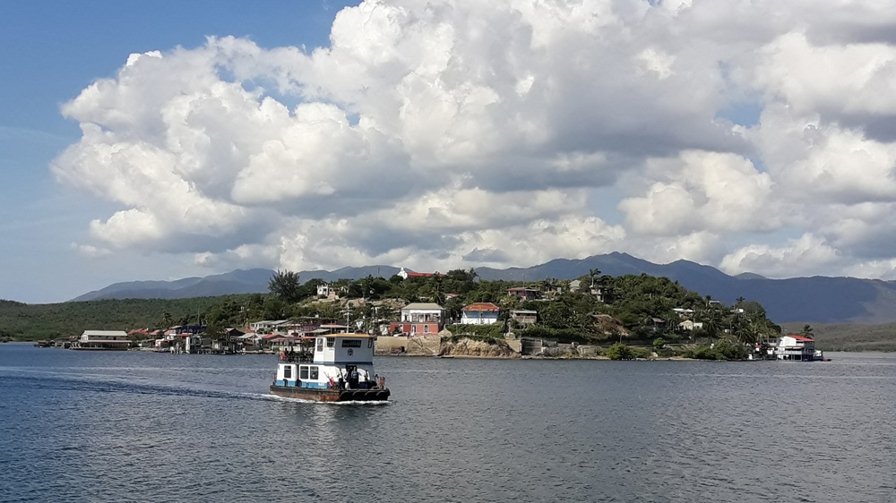 On the outskirts of Santiago de Cuba, a small island appears in the middle of the bay [Al Jazeera] 
